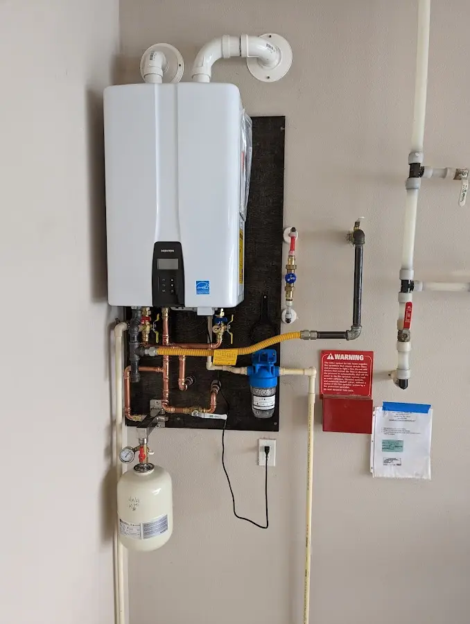 Professional plumber installing copper piping in a Boiling Springs home